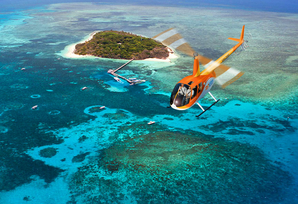An orange helicopter flies over turquoise waters and coral reefs near a small, green island with a dock and several boats.